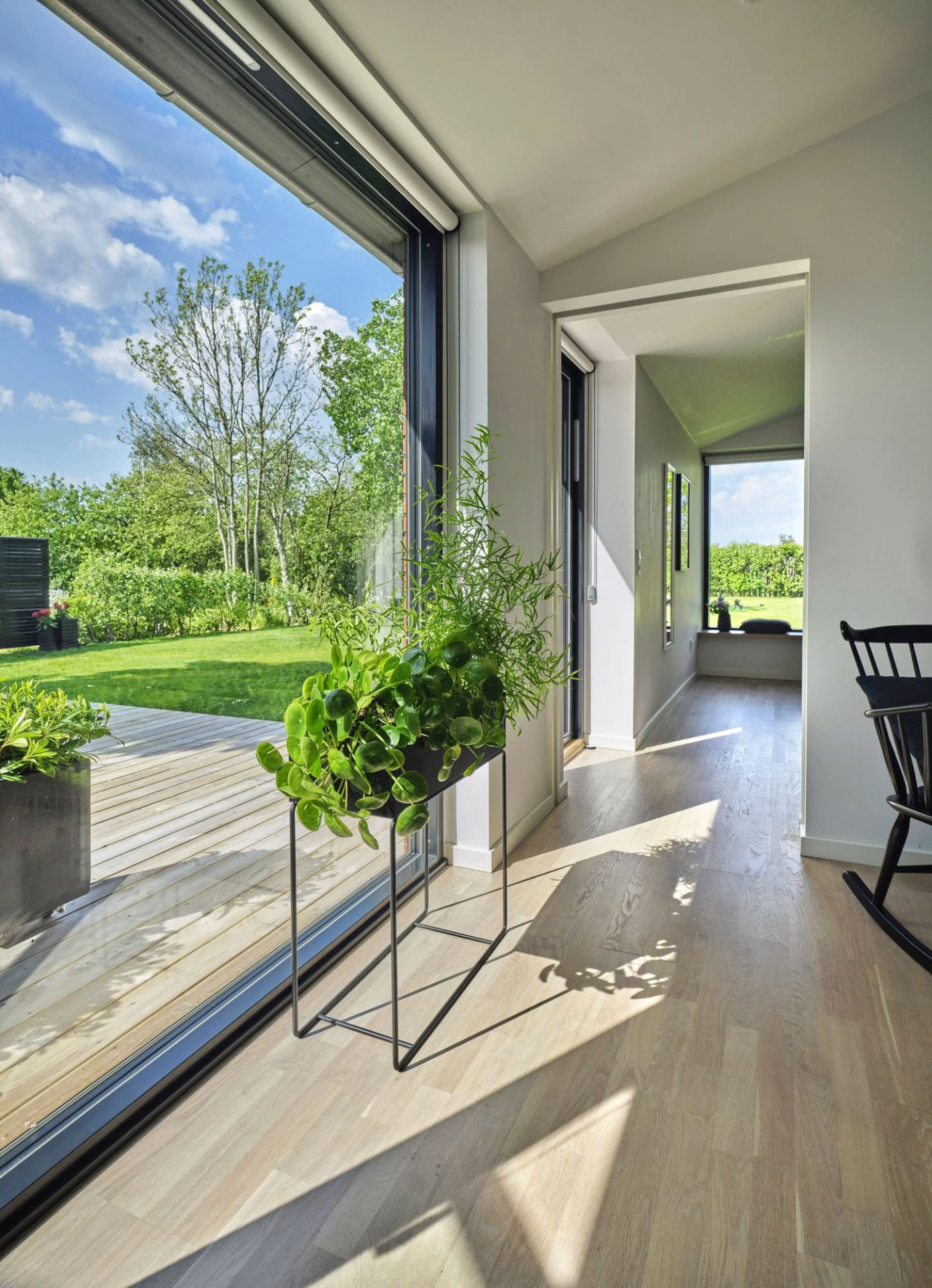 Black VELFAC Ribo frame on a tall glazed door to a garden