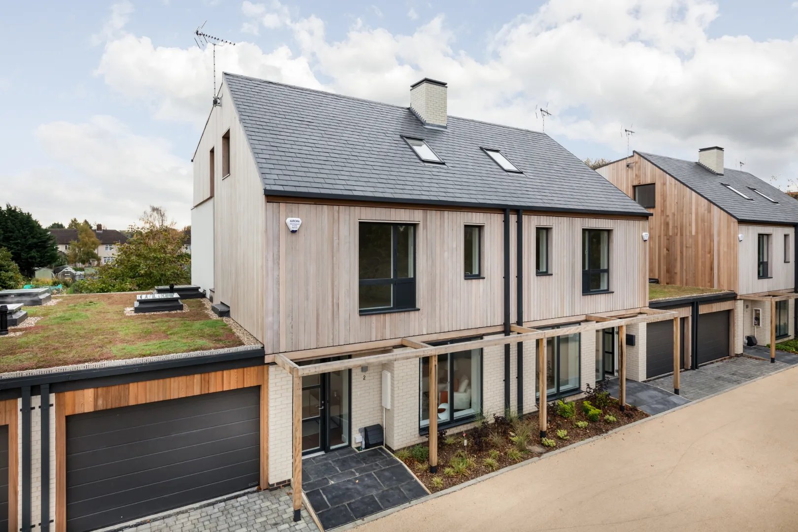 Flush casement aluclad windows across a contemporary terrace