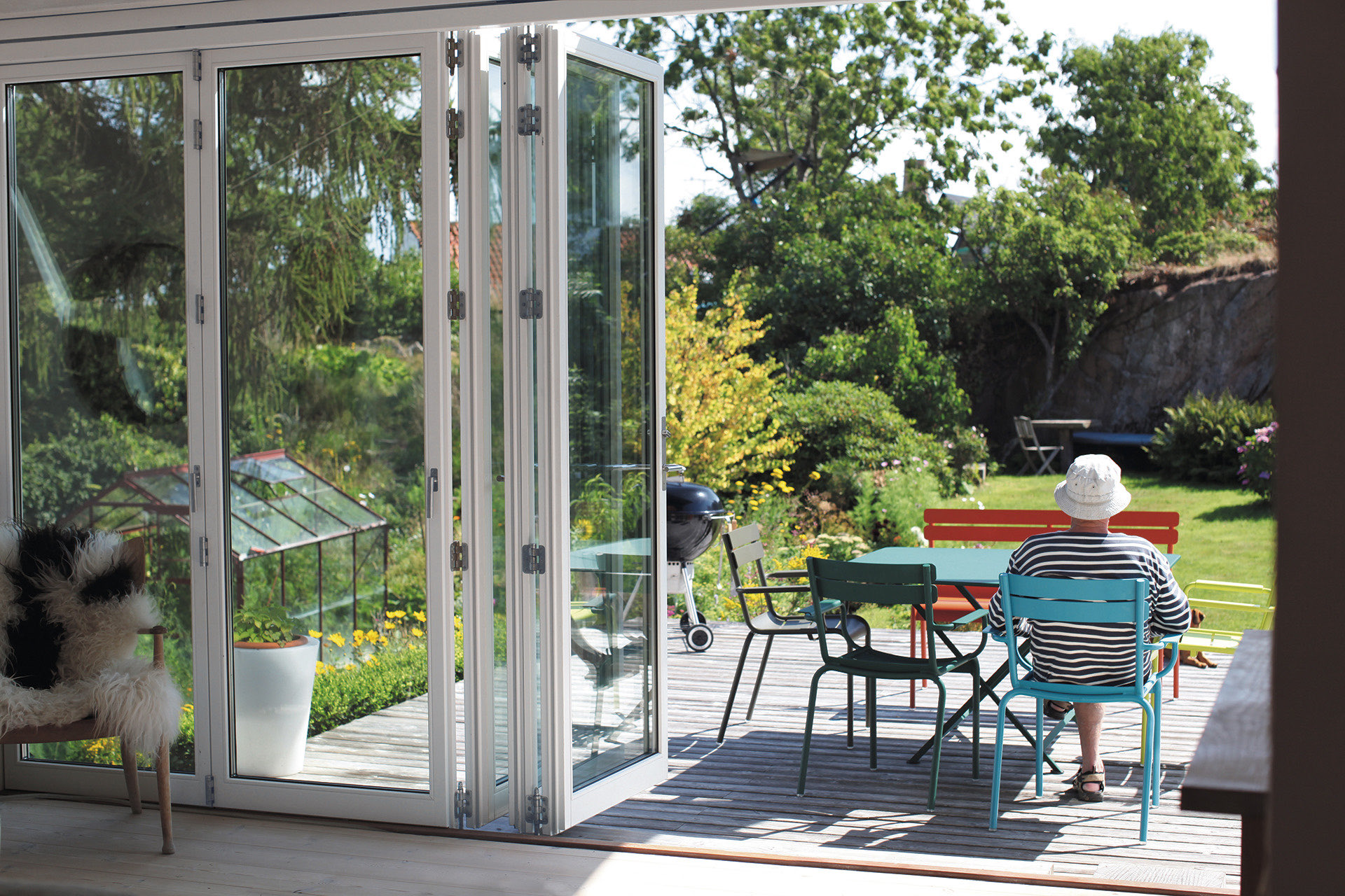 External view of timber folding doors set into a garden elevation