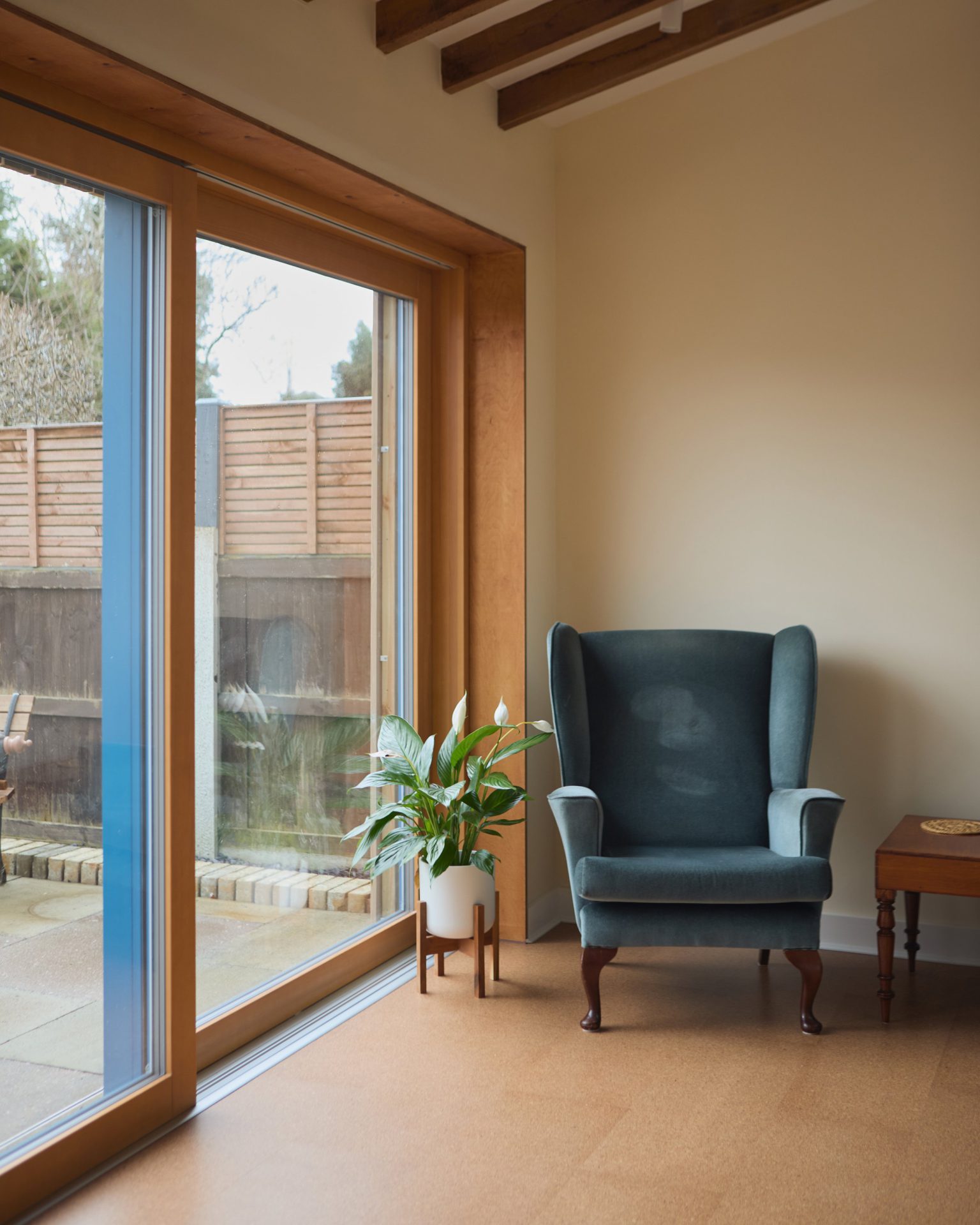 Living space opening onto the garden through full-height glazed doors