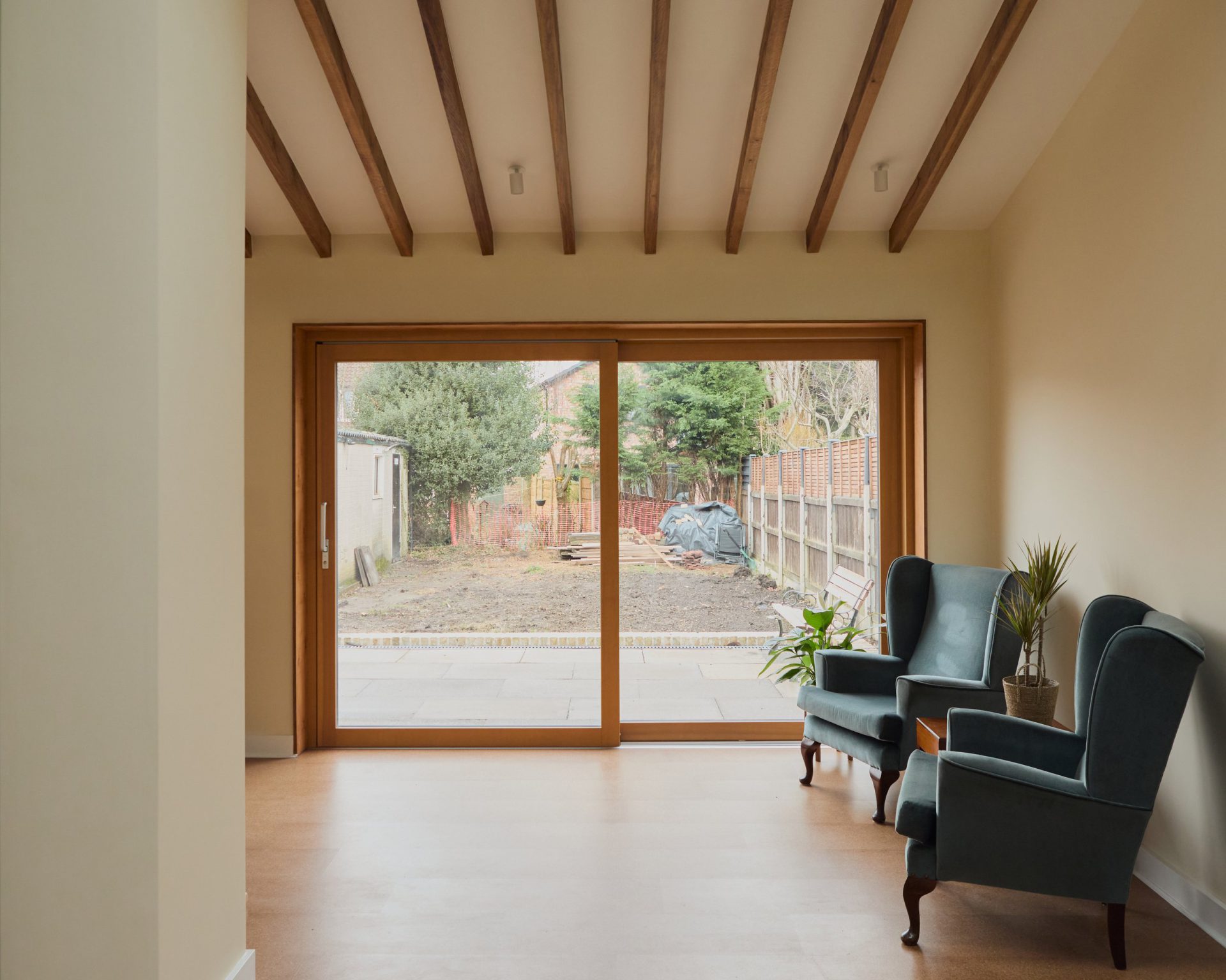 Sliding glazed doors framing the garden from the living space