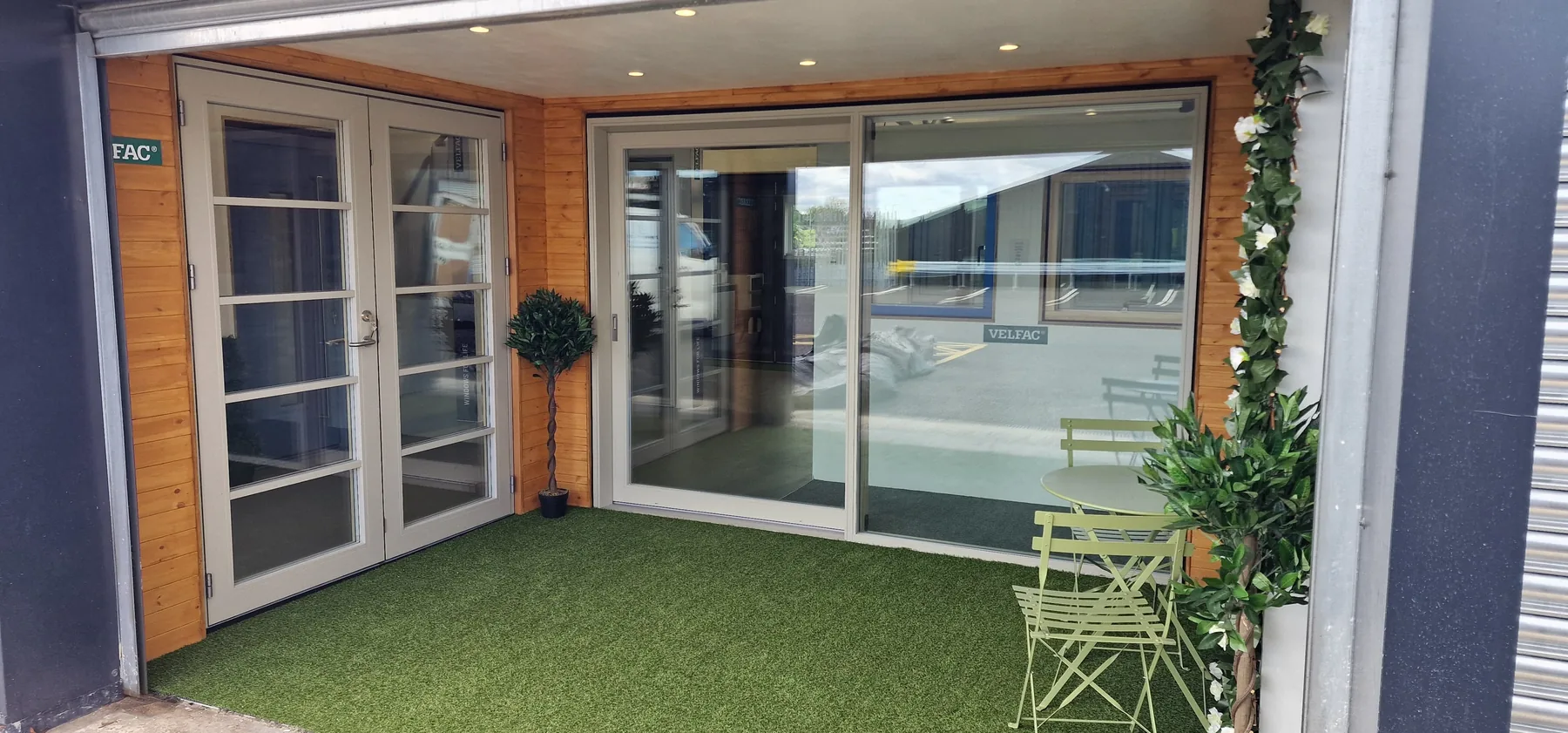 VELFAC French and sliding doors opening onto the showroom terrace